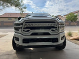 White Ram truck parked on a driveway with a suburban background